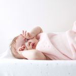 baby on changing mat