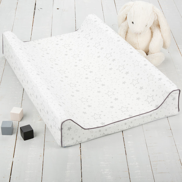 white baby bamboo changing pad on the ground