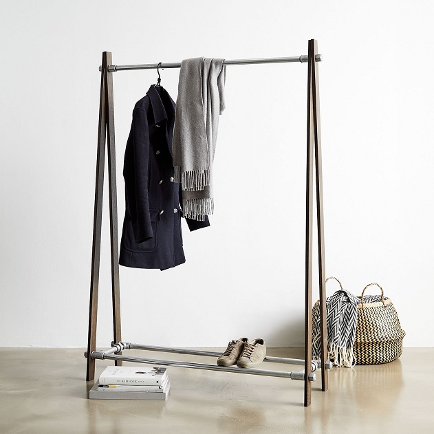 hanging coat and scarf on designer clothing rack