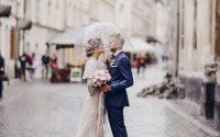 Couple under a wedding umbrella