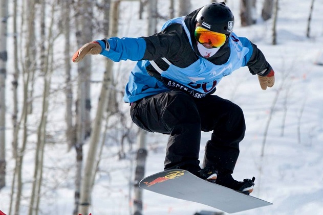 A man snowboarding