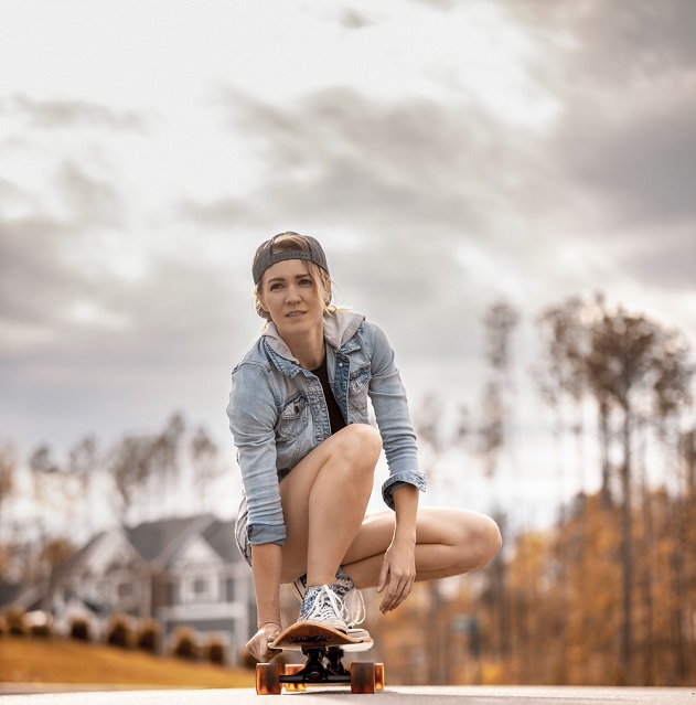 picture of a woman skateboarding on the street