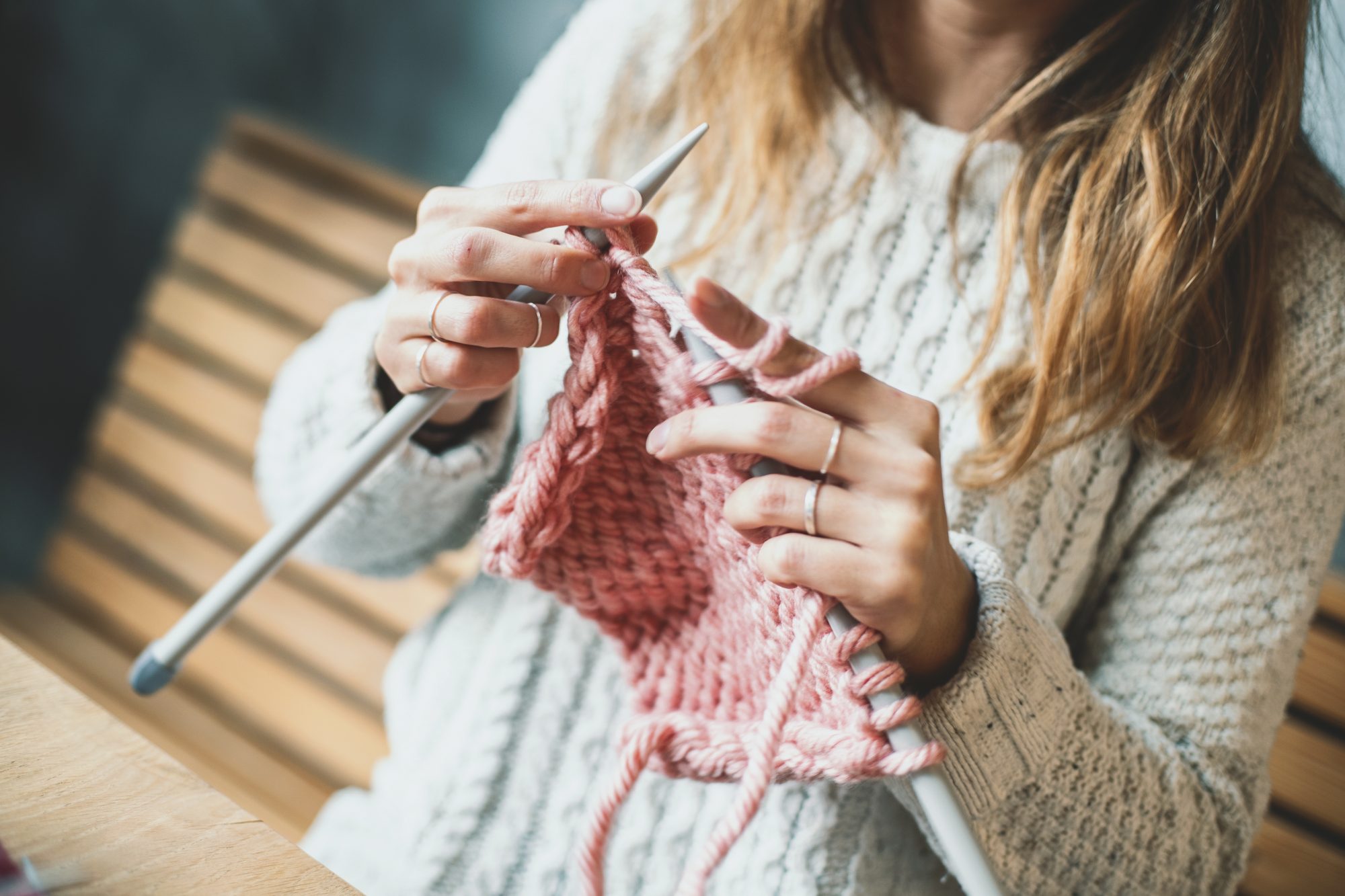 woman-knitting-pink-yarn