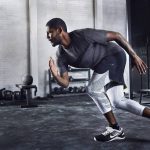 Man working out in proper gym clothes