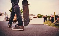 skater holding skateboard