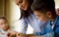 mother helping her son with his homework